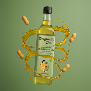 Bottle of 'Originally Desi' groundnut oil with peanuts and oil splashes on a green background